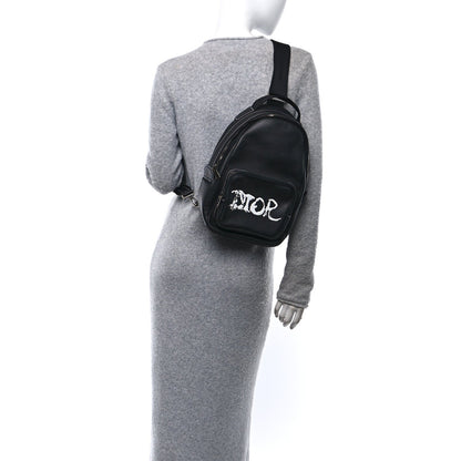 X PETER DOIG Grained Calfskin Slingbag Backpack Black