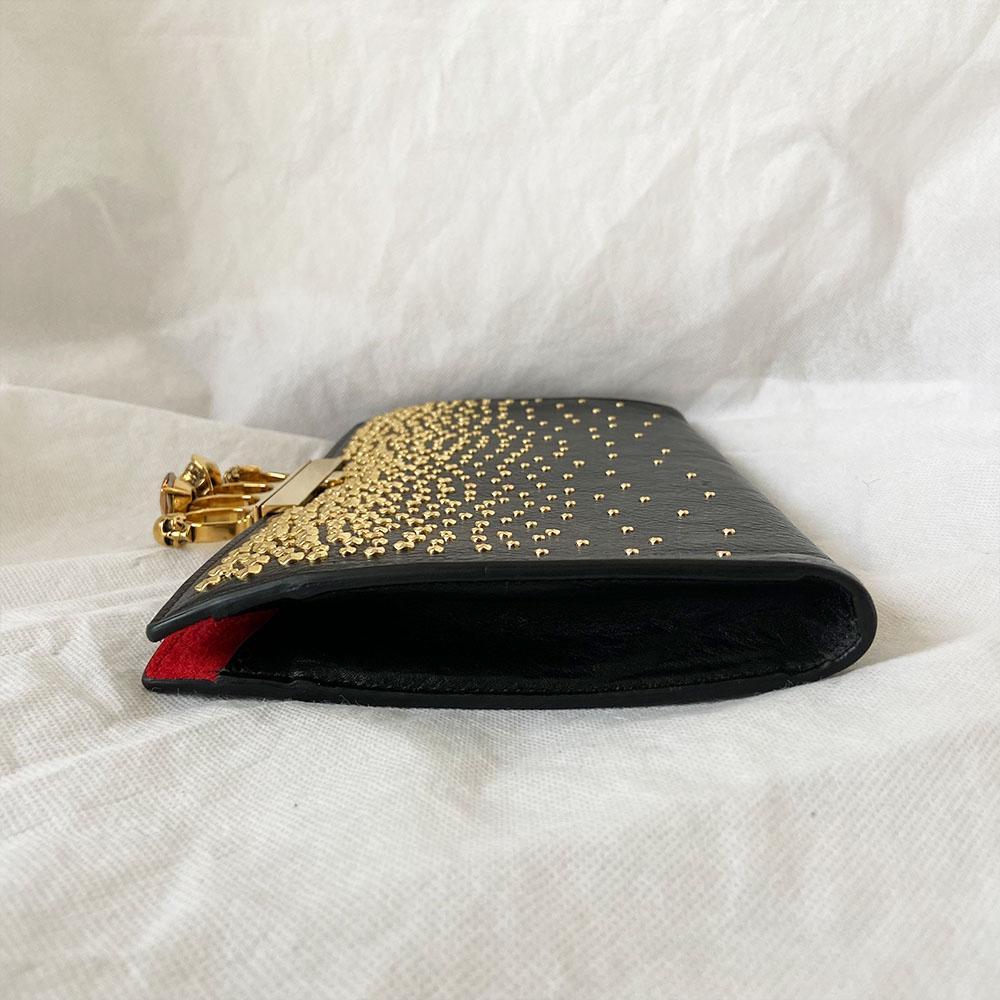 Alexander Mcqueen Skull Four-Ring Clutch Bag
