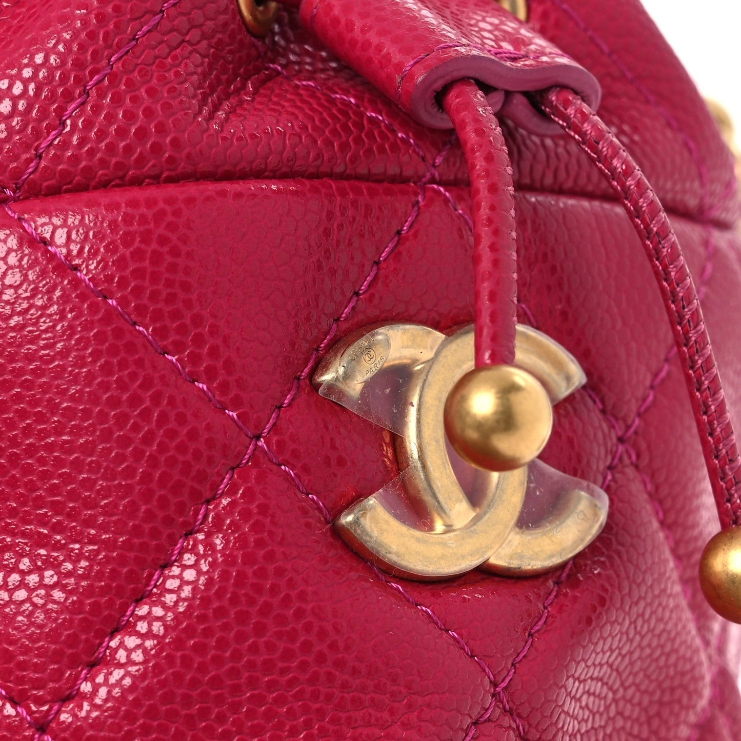 Caviar Quilted Twist Your Buttons Mini Bucket Bag Fuchsia