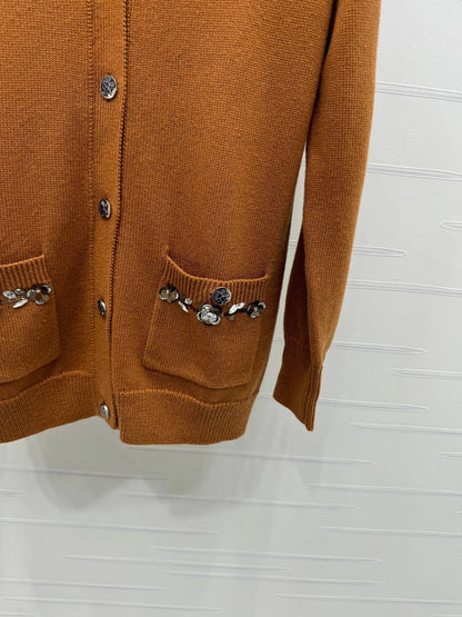 CHANEL HEAVY KNIT CARDIGAN WITH EMBELLISHED FLORAL DETAILS 274877